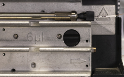 Zoomed-in picture of the Supelco® analytical HPLC column connected properly to the inlet tubing of Agilent® 1290 U/HPLC instrument. Zoomed-in picture of the Supelco® analytical HPLC column connected properly to the inlet tubing of Agilent® 1290 U/HPLC instrument.