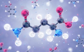 A 3D illustration of a molecular structure featuring interconnected atoms represented by colored spheres, showcasing the complexity of chemical compounds against a blurred background.