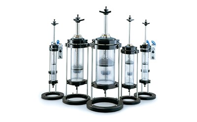 Vantage® columns A set of chromatography columns arranged vertically, used for separating mixtures in laboratory settings.