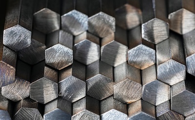 Non-Ferrous Metal Rods 一摞六角形有色金属棒。