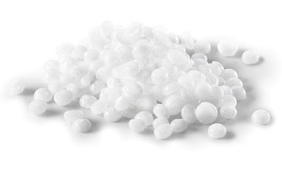 Caustic Alkalis & Bases The image displays a pile of white polystyrene foam balls of various sizes on a uniform white background.