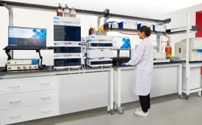 Process Analytical Technology Tools Scientist using Process Analytical Technology tools in a lab.