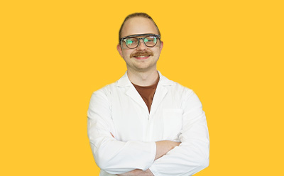 Julian Loeffler Zarrar Nashman headshot on a vibrant yellow background