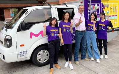 Chemistry on the Go SPARK™ volunteers posing in front of company branded van.