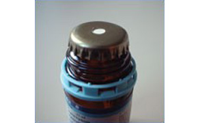Crown-cap with a PTFE faced rubber liner