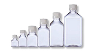 A collection of six clear glass bottles of varying sizes, arranged in ascending order from smallest to largest, against a white background. A collection of six clear glass bottles of varying sizes, arranged in ascending order from smallest to largest, against a white background.