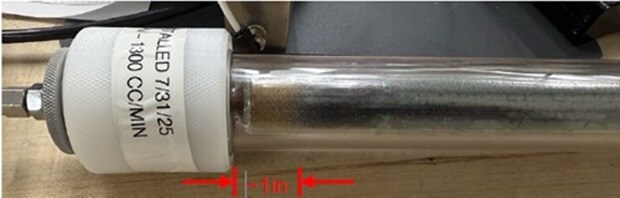 OMI®-4 purifier showing minimal consumption after continuous operation : Close-up of an OMI®-4 gas purifier tube with a small discolored section of about 1 inch, indicating minimal contaminant consumption after extended continuous use.