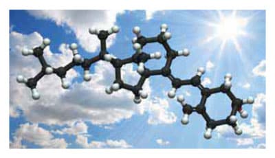 A molecular structure of black and white spheres against a bright blue sky with clouds and sunlight, symbolizing the fusion of science and nature.