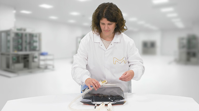 <p>Ready-to-Use Liquid Media for APS</p>
Laboratory worker opens or handles a sealed bag of ready-to-use liquid media in a cleanroom environment.