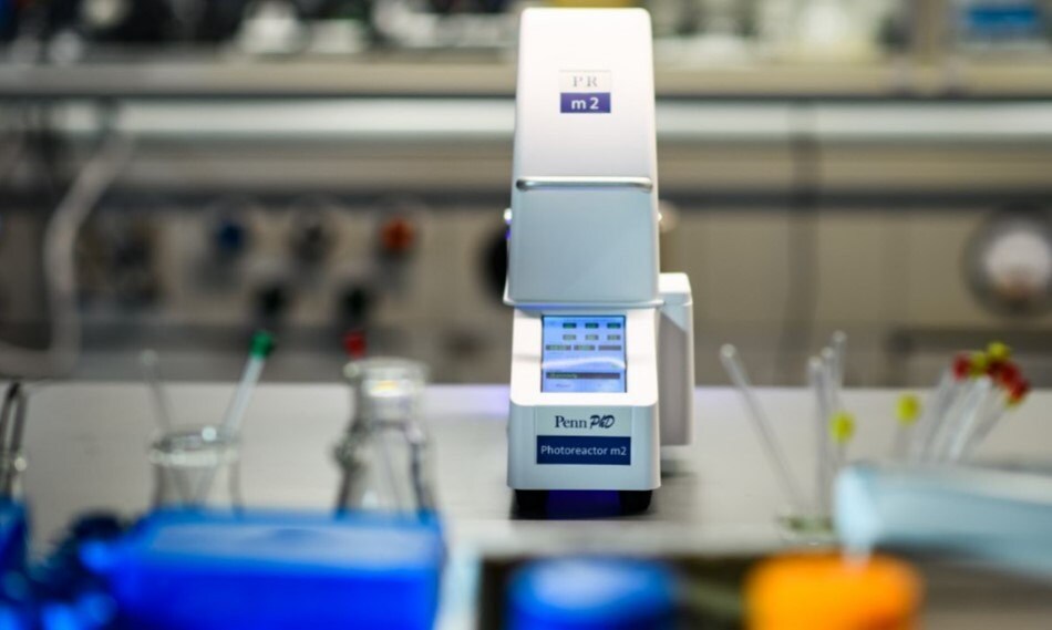 Photoreactor in organic synthesis lab for photoredox catalysis.