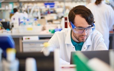Lab worker at his station.
