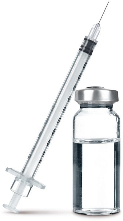 A clear glass vial filled with liquid, sealed with a metal cap, next to a transparent syringe with measurement markings.