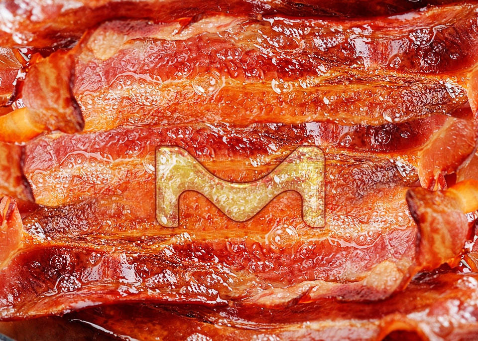 The letter M on bacon.