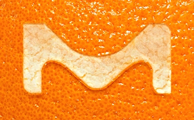 The letter M on an orange peel.