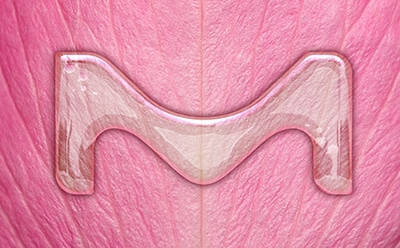 The letter M on a pink leaf.