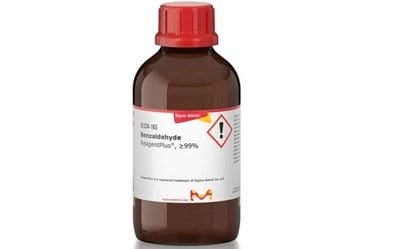 Benzaldehyde A brown bottle with a red cap labeled “Formaldehyde, Stabilized, ≥99%.” The label includes hazard symbols indicating flammability and health risks, as well as a Sigma-Aldrich logo. The background is plain white.