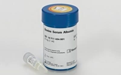 A container of Bovine Serum Albumin (BSA) with a small vial next to it. This setup is typically seen in a laboratory setting, where BSA is used in various biochemical applications due to its stability and lack of interference with biological reactions. The vial suggests that precise amounts of BSA can be stored and used as needed.