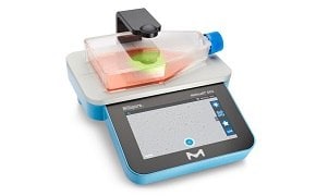  A modern digital laboratory scale with a blue base and a touchscreen interface. 