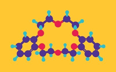 Ball-and-stick model of dibenzo-18-crown-6 molecular structure on yellow background. Purple balls represent carbon atoms, cyan balls represent hydrogen atoms, and red balls represent oxygen atoms. The molecule displays a large, intricate three-dimensional structure with multiple interconnected rings and branching chains throughout.