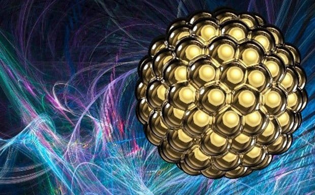 Computer illustration of a spherical gold nanoparticle floating through abstract background.