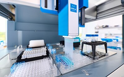 Lab Automation with the AAW™ Workstation Inside closeup view of the AAW™ workstation deck with plates, pipettes, and gripper for lab automation.