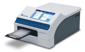 Product photo showing an instrument with a microplate holder.