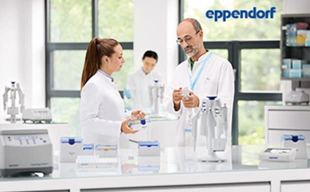 Eppendorf Scientists at lab table looking at Eppendorf labware