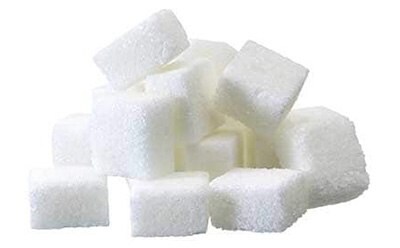 Carbohydrate reference materials A pile of white sugar cubes neatly stacked against a plain white background. The cubes are uniform in size and shape, suggesting a sense of order and simplicity. The image highlights the granular texture of the sugar cubes.