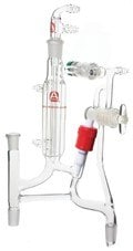 Photo of custom chemistry glassware including glass tubing, stopcocks, fittings, and the reaction vessel