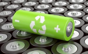 Green lithium ion battery with a circular arrows icon over a background of metallic batteries, indicating sustainable battery practices.