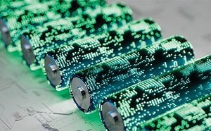Close-up of cylindrical lithium ion batteries displaying digital light patterns to represent modern energy materials.