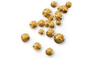 Uniform spherical gold nanoparticles suspended in a fluid matrix, showing their mobility and distribution in a colloidal system.