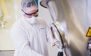 Scientist in production plant, fully gowned Scientist in production plant, fully gowned
