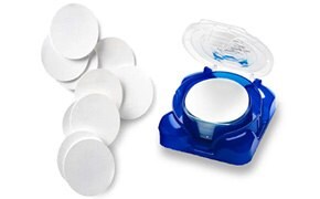 Millipore<sup>®</sup> Filter Membranes Pile of Millipore filter membranes with stack of filters in plastic container.