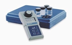 Portable Turbiquant turbidimeter used to measure turbidity in water samples with calibration vials and carrying case.