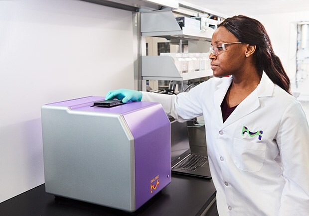 Image of a scientist performing analysis with ultrasensitive Single Molecule Counting (SMC®) technology on the SMCxPRO® platform which can be applied to cosmetics and personal care product research.