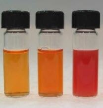 Photograph of aqueous dispersions of selenium nanoparticle ranging in color from orange to red.