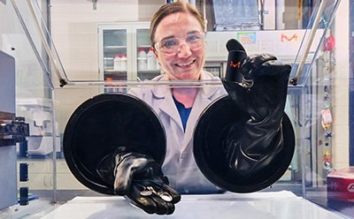 A digital illustration of a laptop displaying a simplistic human figure next to a pink rectangle, all set against a yellow background.